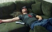 Using the lazy bed glasses on the couch to watch tv