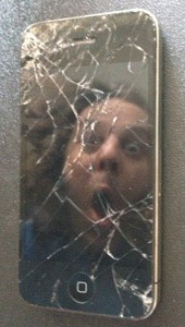Broken iPhone 4 with shattered screen