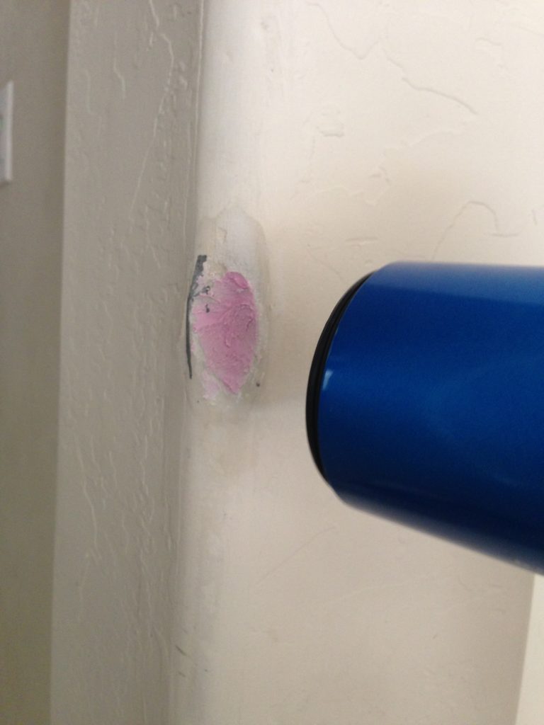 drying spackle in damaged rounded drywall edge