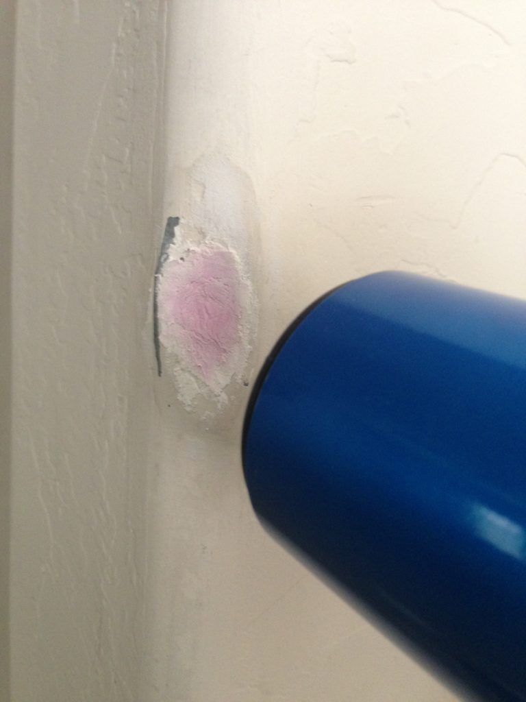 fixing dent in bullnose corner; nearly dried pink spackle