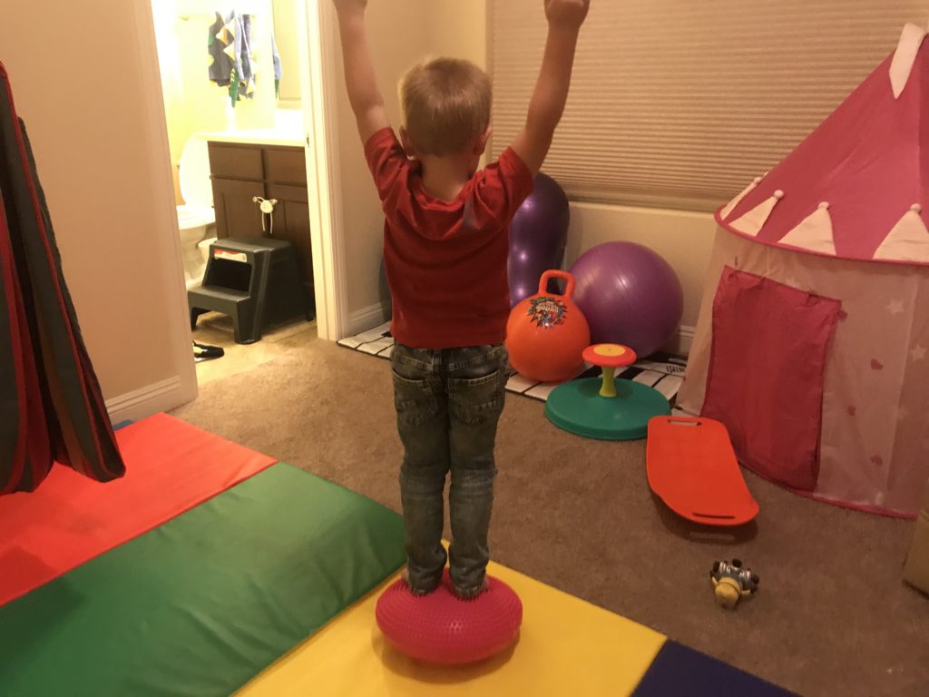 hyperactive son on inflatable stability disc